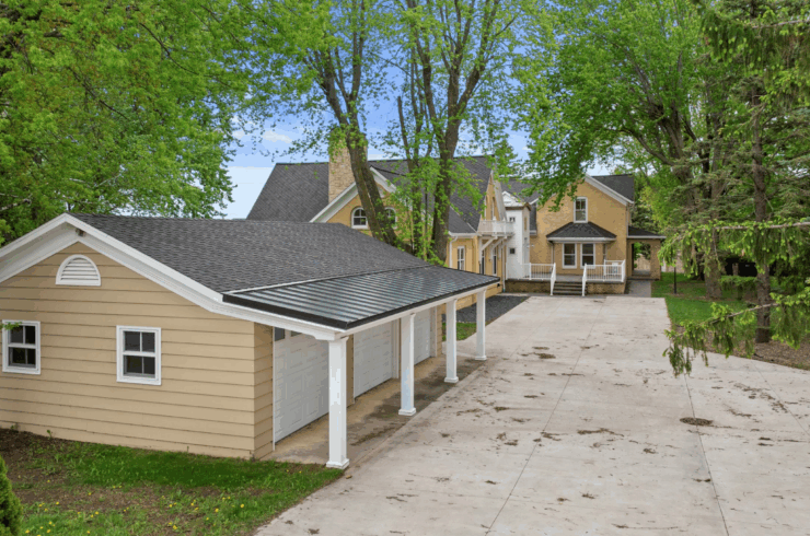 The three car garage at the entrance to the residence