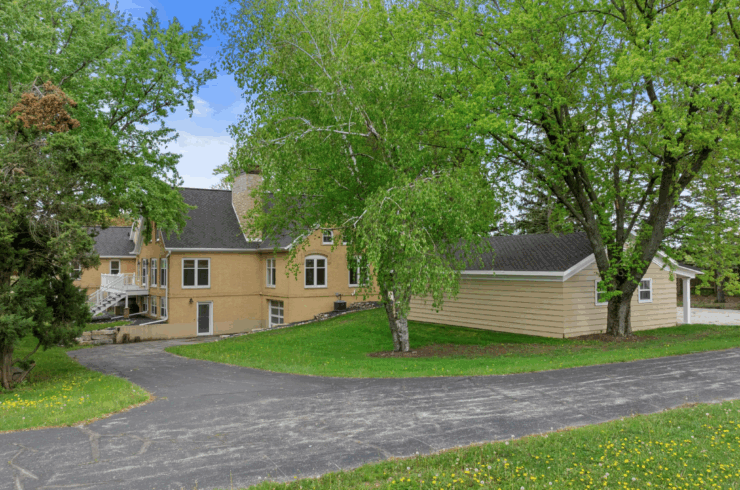 The secondary private drive leading to the back of the residence