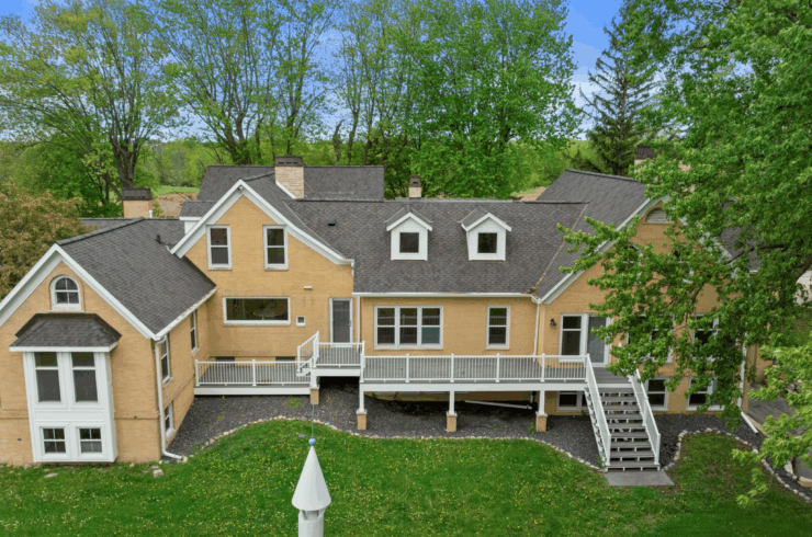 A deck stretches across the entire back of the residence.