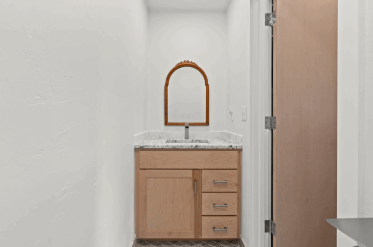 The half bathroom attached to the primary bedroom - this is in addition to the main primary bathroom