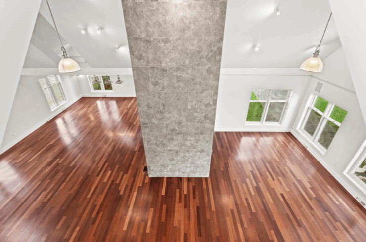 There is a balcony overlooking the ballroom from the primary bedroom